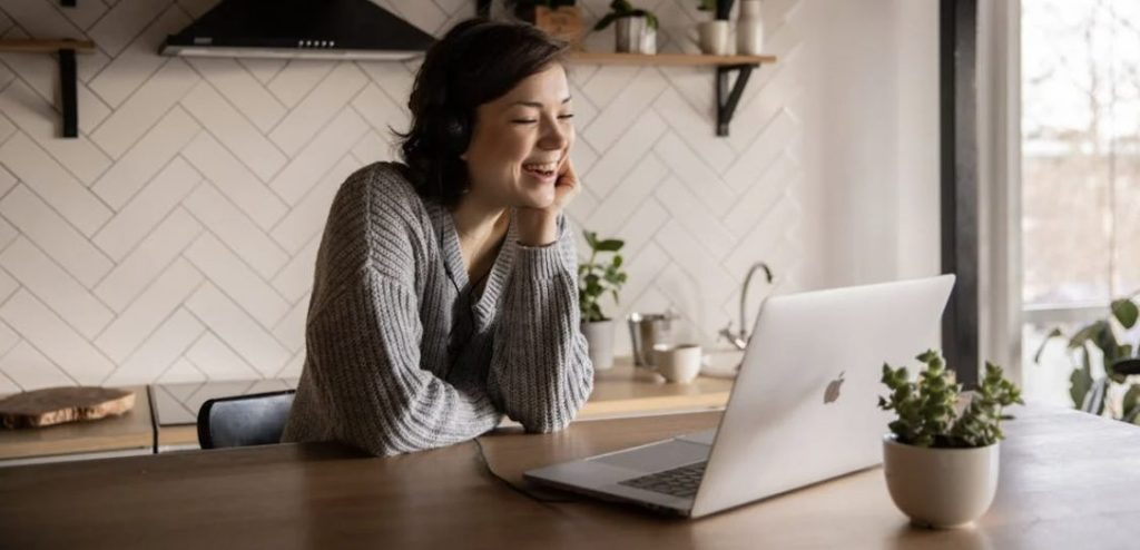 Woman happy on laptop